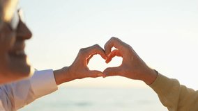 Love heart shape peace. Senior older couple making heart shape with their hands. Adult mature old husband wife showing heart sign. Happy pensioner family. I love you happy valentines day - Powered by Shutterstock - Get 15% off with code: PIKWIZARD15