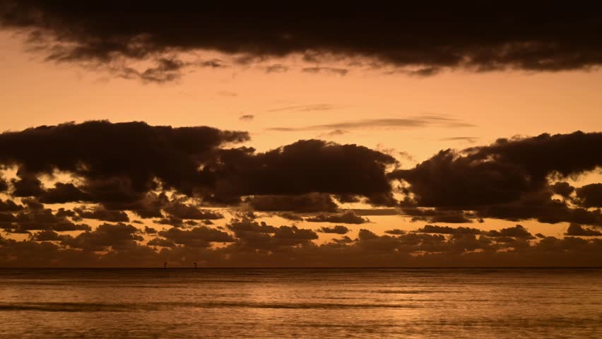 A calm morning along the coast north of Cairns, Queensland, with soft light rising over the Coral Sea—serene ocean views, gentle waves, and tropical stillness set the tone for a peaceful day ahead.