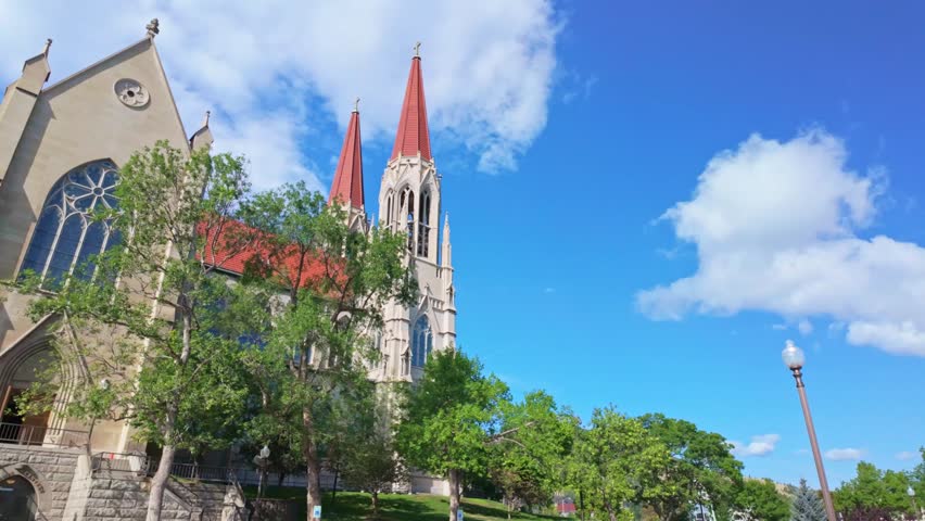A gorgeous building of the Cathedral of Saint Helena is captured on a summer day, highlighting its stunning architecture and prominent role in the city