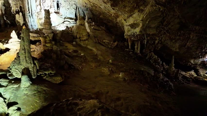 A scenic and illuminated view of the caverns inside Lewis and Clark Caverns State Park is captured, highlighting the stunning geological formations and the unique lighting that enhances their beauty