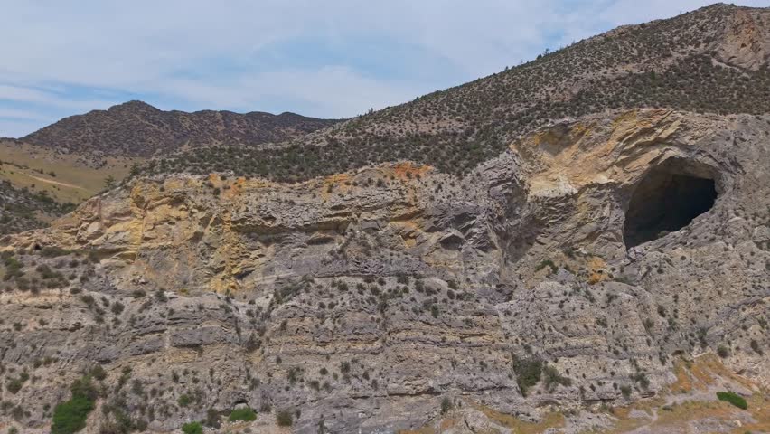 An aerial view of the Jefferson River and the Lewis and Clark Caverns State Park is captured, showcasing the confluence of the natural waterway and the iconic park from an elevated perspective