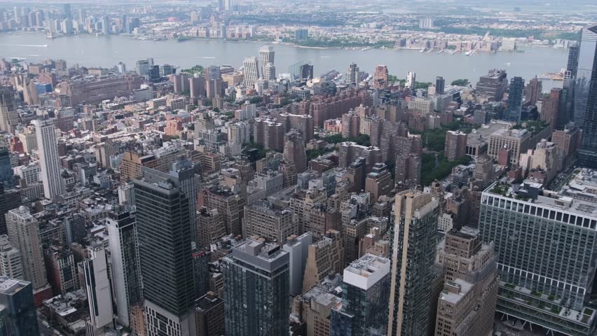 Aerial view of New York City skyline with flowing river