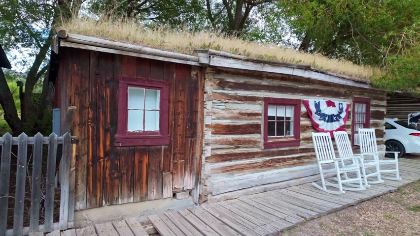 A collection of old, vintage wooden buildings captured at the Nevada City Living History Museum in Montana on summer day