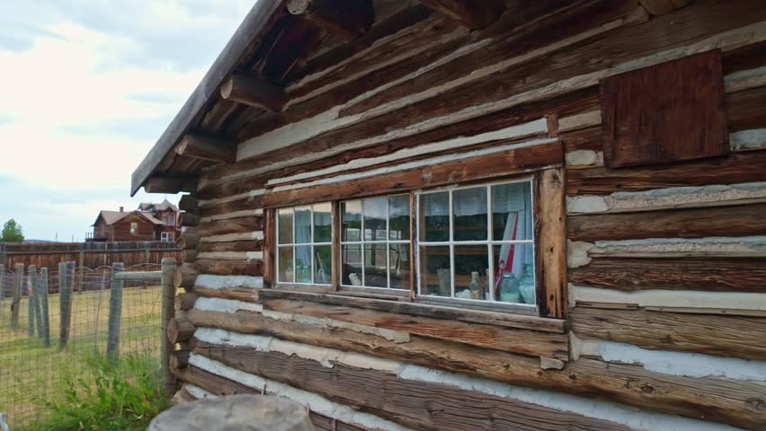 A collection of old, vintage wooden buildings captured at the Nevada City Living History Museum in Montana on summer day