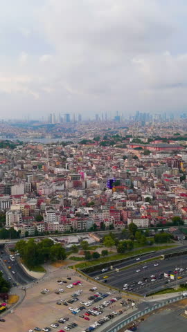 Vertical video. Istanbul, Turkey. General view. Historical Center. Fatih district. Cloudy weather at sunset, Aerial View. Rich colors
