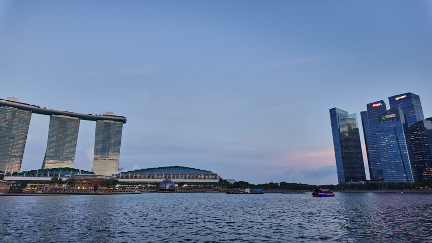 Singapore Marina Bay Skyline with Ferris Wheel and ArtScience Museum at Night