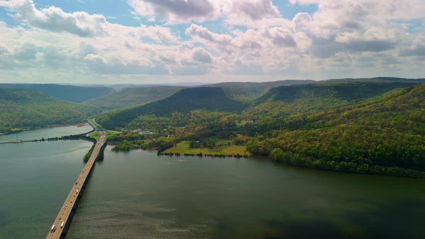 An aerial view of bridges crossing the wide Tennessee River on Marion County Park near Chattanooga on a sunny day in Tennessee, USA