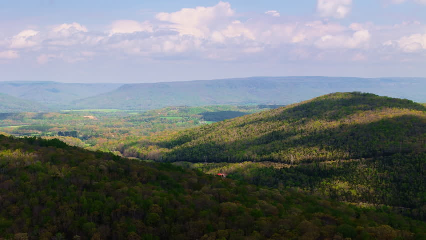 An aerial view of green spring mountains with tourist trail near Chattanooga on a sunny day in Tennessee, USA