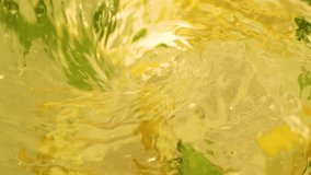 Slow motion mixing fresh coctail from lemon fruits and mint leaves, soda drink - Powered by Shutterstock - Get 15% off with code: PIKWIZARD15