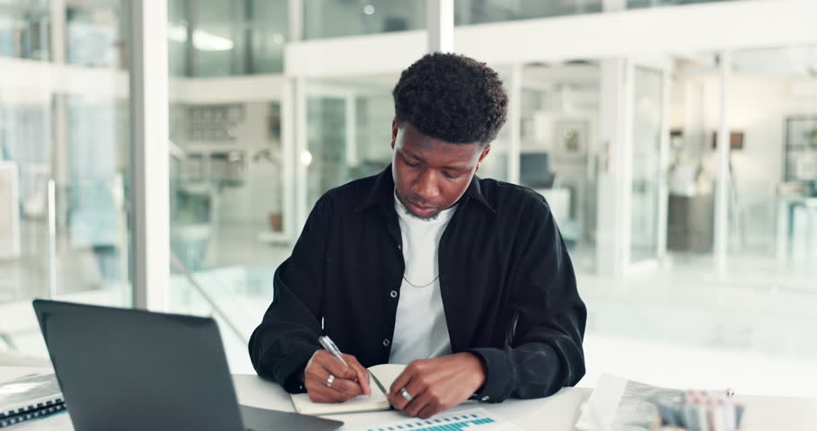 Black man, writing notes and thinking at office with finance, trading and decision for investment opportunity. African person, book and perspective with plan, review or charts with budget at agency