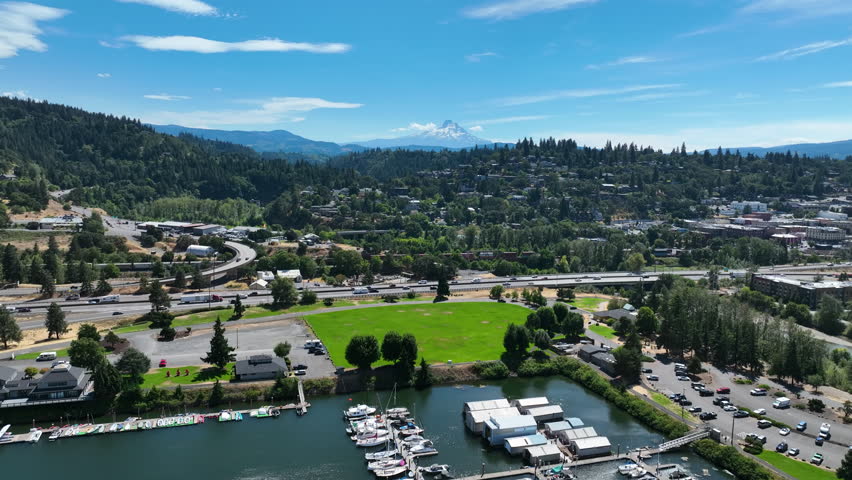 Aerial pull back over the Hood river town and marina, sunny day in Oregon, USA