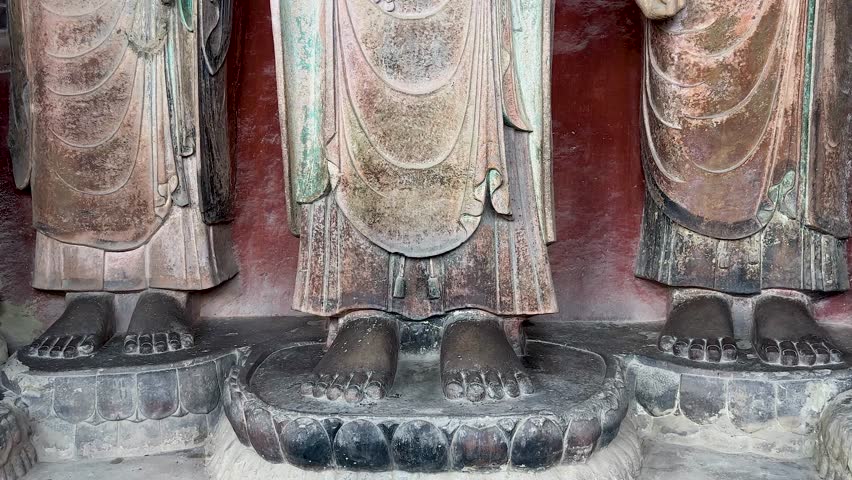 Big Buddha statue with two disciples, two Bodhisattvas standing at both sides in Big Buddha Grotto at Huangze Temple in Guangyuan, Sichuan, China, only Buddhist temple dedicated to Wu Zetian.