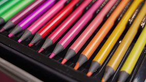 Detailed closeup of colorful pencils in warm tones arranged neatly in a case. Perfect for creativity, education, design, and artistic projects. - Powered by Shutterstock - Get 15% off with code: PIKWIZARD15