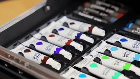 Macro closeup of watercolor paint tubes arranged neatly in a box. Perfect for creativity, education, design, and artistic projects. - Powered by Shutterstock - Get 15% off with code: PIKWIZARD15