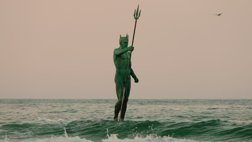Statue of Poseidon with a trident standing in the sea at sunset in Varna, Bulgaria. High quality 4k footage