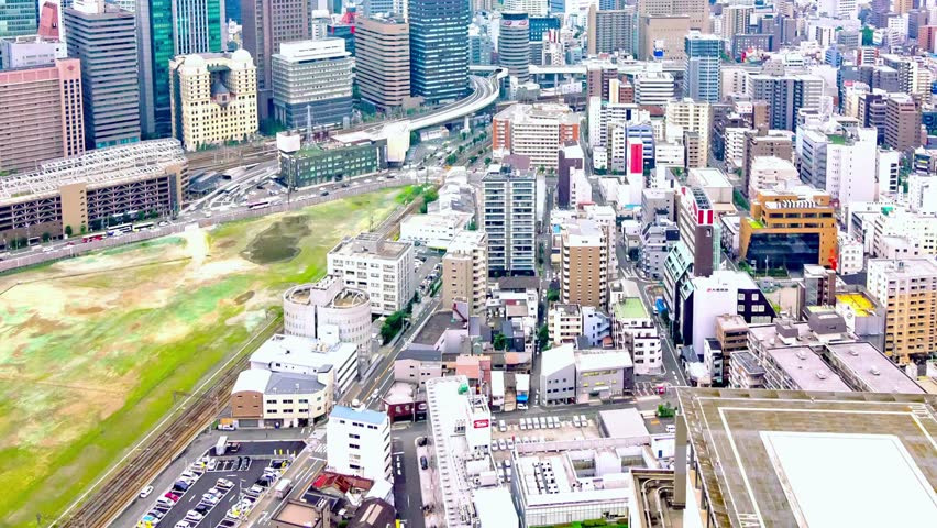 We present an HD time-lapse of Osaka, Japan’s bustling street skyline. Streams of traffic weave through the city, while glowing lights and towering buildings highlight the urban pulse. 