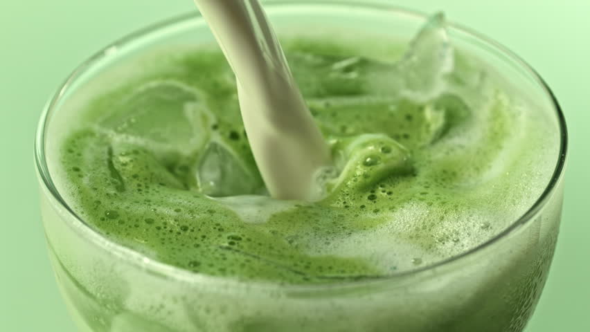 Super Slow Motion Detail Shot of Pouring Cream into Matcha Latte with Camera Motion at 1000fps.