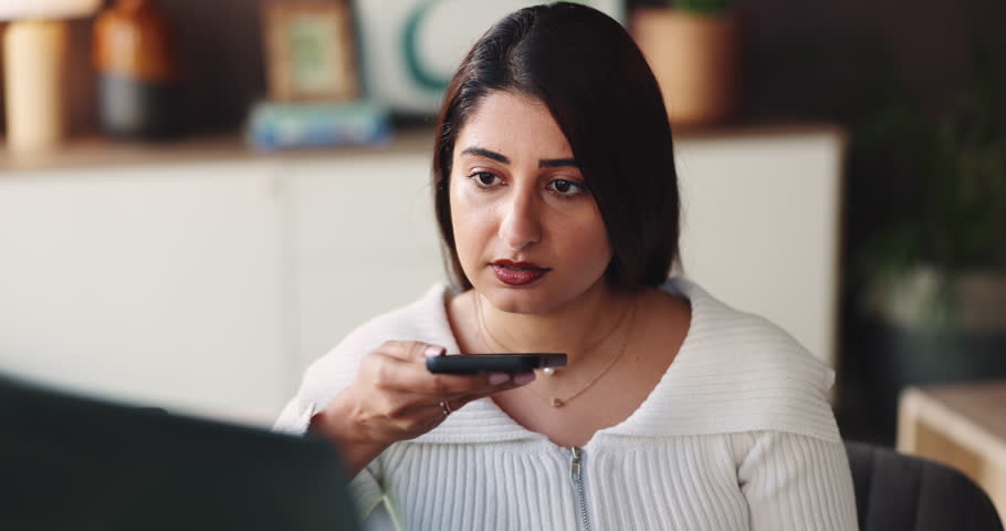 Business laptop, woman and phone with speaker for online interview, audio message or contact source. Journalist, person and smartphone with voice recording at publishing agency for article discussion