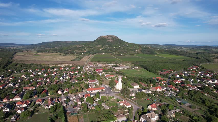 Aerial view of Gyulakeszi village and Csobánc Hill, Balaton Uplands, Hungary.