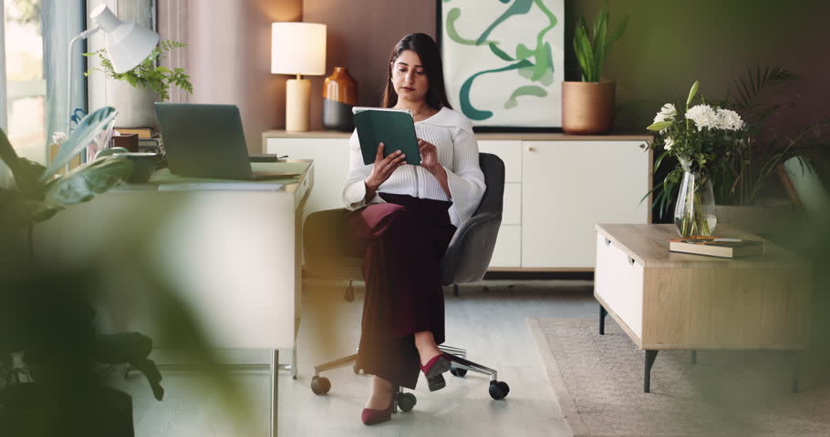 Woman, remote work and reading on tablet at house for accounting, finance report and review budget. Thinking, accountant and digital for audit, financial planner and investment funding in home office