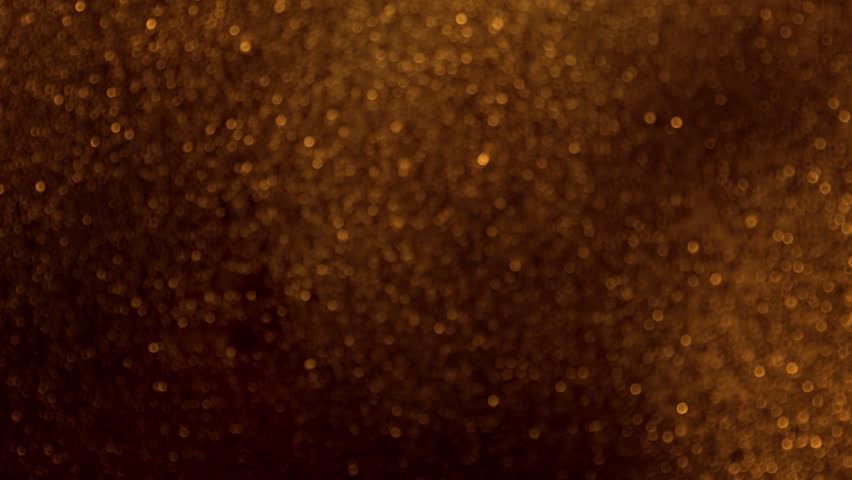 Super Slow Motion Shot of Glittering Golden Background at 1000fps.