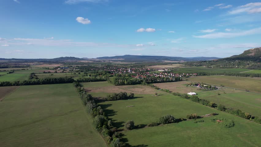 Aerial view of Gyulakeszi village and Csobánc Hill, Balaton Uplands, Hungary.