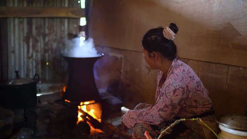 
Cooking with firewood. Traditional Indonesian cooking methods