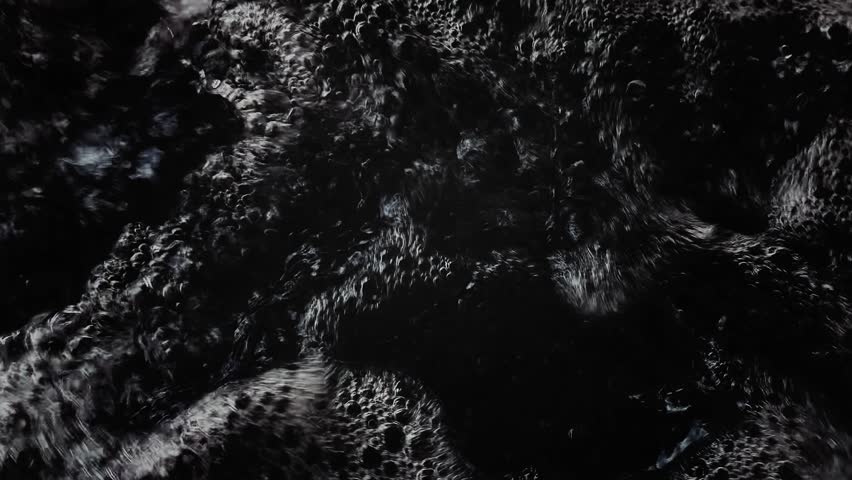 Boiling Black Water Background. Dark Turbulent Liquid Surface Texture, Swirling Abstract Motion, Stormy Fluid Pattern for Dramatic, Nature, Horror or Abstract Use.