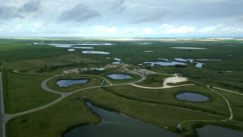 Establishing Aerial of Conservatory amid Canadian Marshland