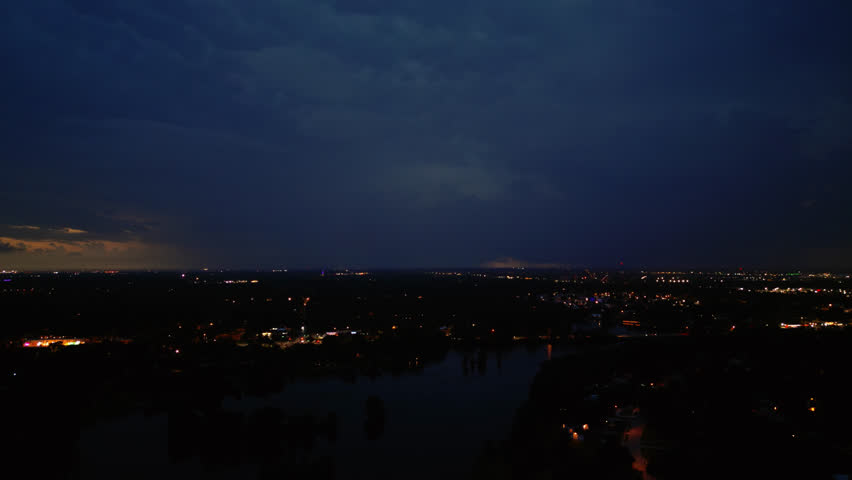 A Raging Thunder and Lightning Storm In The Evening Sky Over Downtown Tampa In Florida - Slow Drone Shot