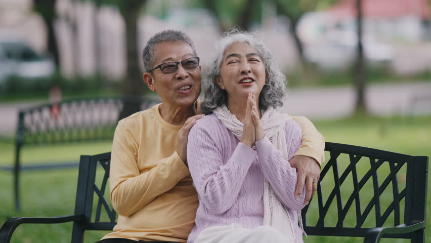 Senior Asian couple enjoying time together in park