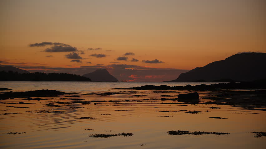 Camera looking towards the sunset into the horizon in Norway