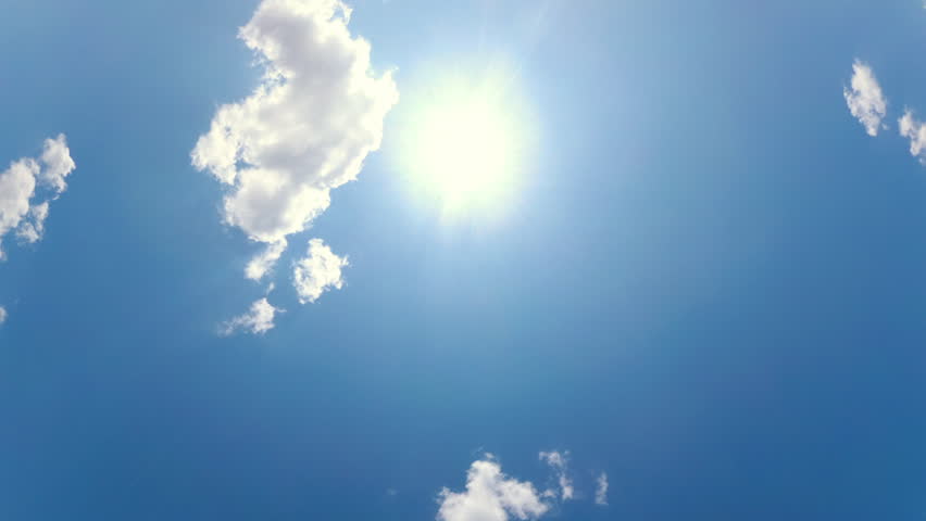 Blue Sky with White Clouds and Sun. Puffy Fluffy White Clouds Moving Fast. Cumulus Cloudscape Timelapse. Summer Nature Weather Sky Time Lapse Video