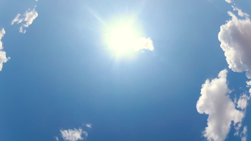 Blue Sky with White Clouds and Sun. Puffy Fluffy White Clouds Moving Fast. Cumulus Cloudscape Timelapse. Summer Nature Weather Sky Time Lapse Video