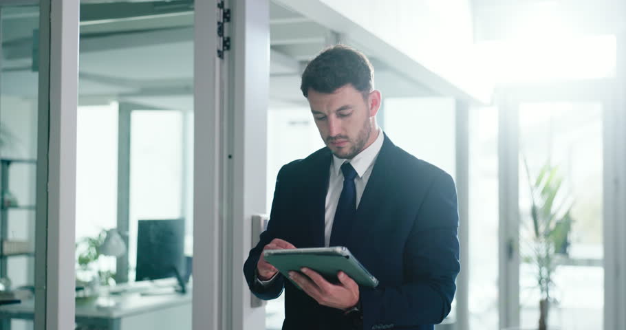 Walking, businessman and online on tablet, office or browsing for investment opportunity on website. Investor, search and person with tech for financial report, scroll and review stock market updates