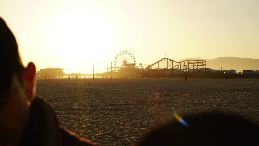 waves crashing on the sand at dusk
