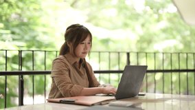 Young Asian woman joyful about remote work success She uses a laptop outdoors enjoying her freelance achievement in nature - Powered by Shutterstock - Get 15% off with code: PIKWIZARD15