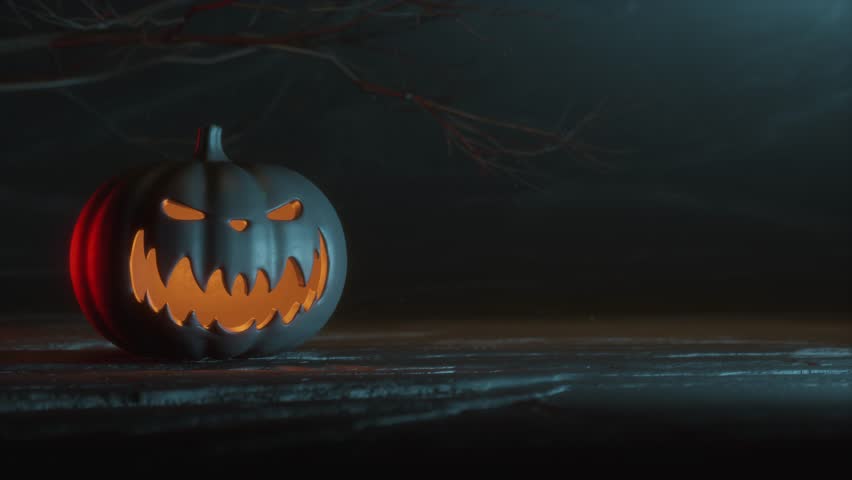Carved Halloween Pumpkin with Glowing Interior on Black Background – Spooky Holiday Animation
