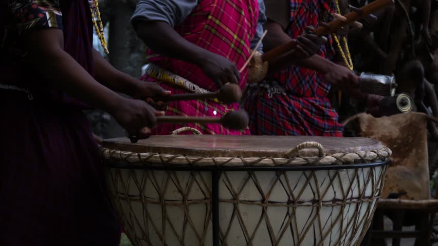 Traditional African Drum Performance in Vibrant Attire