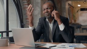 African American business man talking phone stress sad businessman problem office manager frustrated emotion listening bad news talk with smartphone discuss male middle-aged entrepreneur conversation - Powered by Shutterstock - Get 15% off with code: PIKWIZARD15