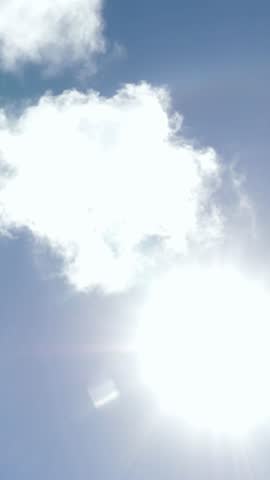 Airplane flying on blue sky. Taking off or landing plane. Vertical footage