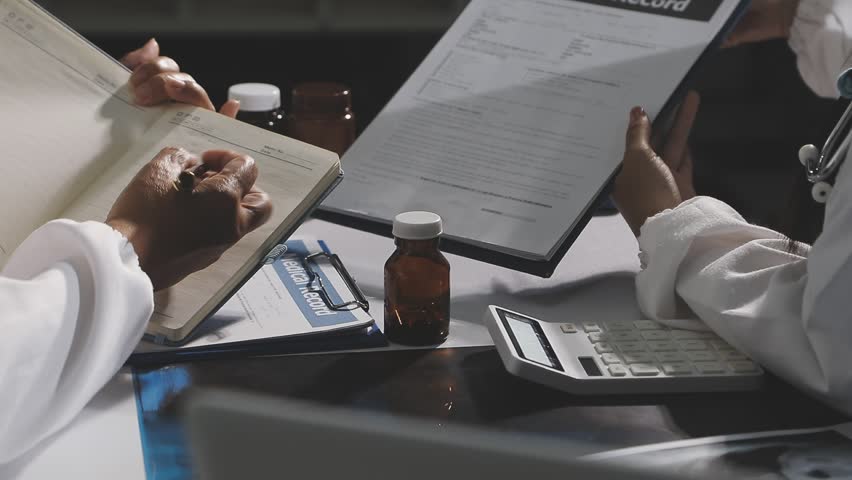  Group of doctors having meeting in office