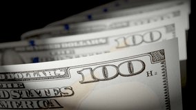 Slow Pan of United States 100 Dollar Bills. - Powered by Shutterstock - Get 15% off with code: PIKWIZARD15