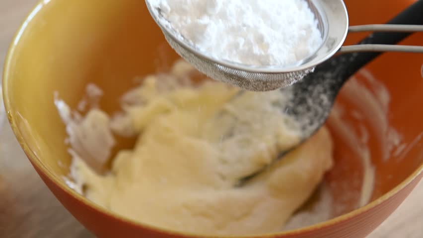 Mixing sugar and butter for baking preparation