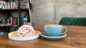 A Delightful and Delicious Coffee Alongside an Amazing Dessert Experience Awaiting You. A beautifully crafted latte alongside a delicious pastry resting on a warm wooden table, ideal for cafe goers. - Powered by Shutterstock - Get 15% off with code: PIKWIZARD15