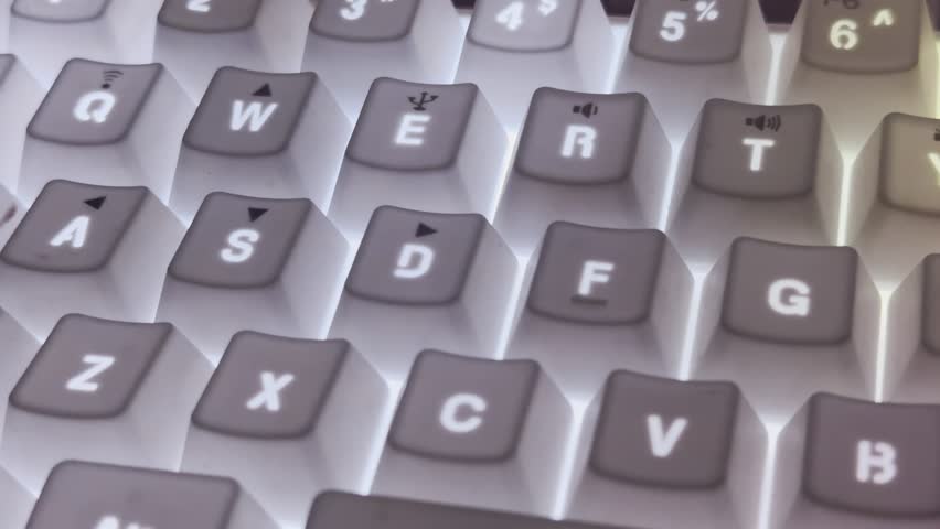 Close-up video of mechanical computer keyboard with RGB backlight changing colors, glowing keys with neon light effect, abstract background for gaming, technology and modern digital lifestyle concept. - Powered by Shutterstock - Get 15% off with code: PIKWIZARD15