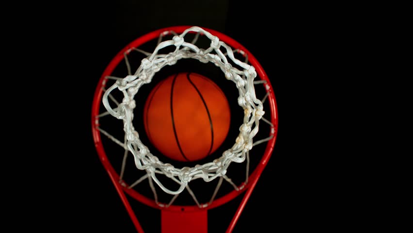 Super slow motion of basketball ball hitting the basket , Down shot . Filmed on high speed cinema camera , 1000 fps