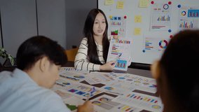 Asian businesswoman startup presenting data chart project management meeting with colleagues, financial report analysis teamwork strategy plan corporate success at office, marketing, data analytics - Powered by Shutterstock - Get 15% off with code: PIKWIZARD15