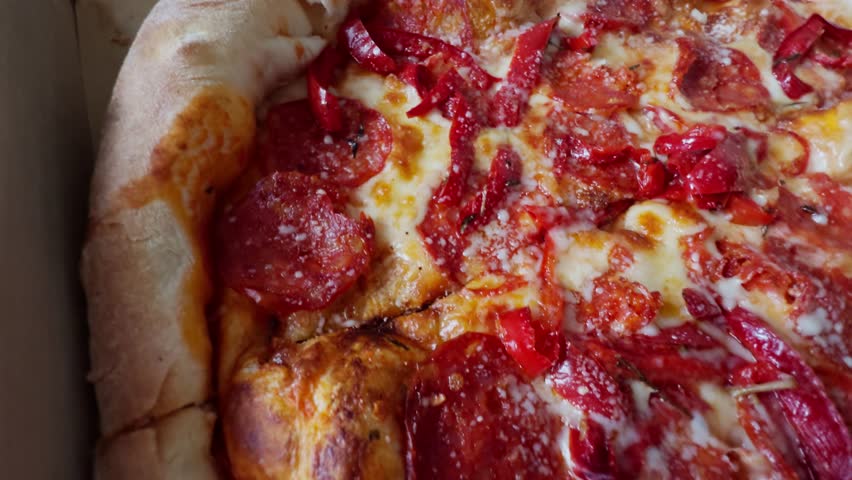 Delicious Pepperoni Pizza With Melted Mozzarella And Red Peppersю Freshly Baked Pizza, Hot And Cheesy, Appetizing Food. Takeout Meal Italian Cuisine. Lunch Or Dinner Fast Food, Comfort Food Pizza