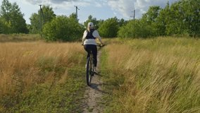Female Cyclist Biking On Rural Path. Outdoor Ride Fitness Training In Nature Active Lifestyle Sport. Outdoor Recreation Activity. Trail Riding. Mountain Biking Cycling. Cyclist Cardio Training Cycling - Powered by Shutterstock - Get 15% off with code: PIKWIZARD15